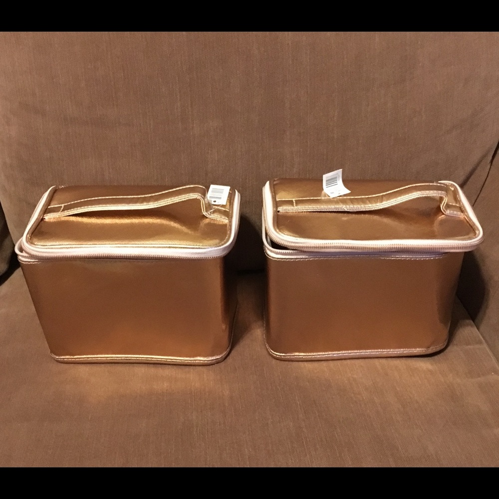 Gold Lord & Taylor collapsible pouches.